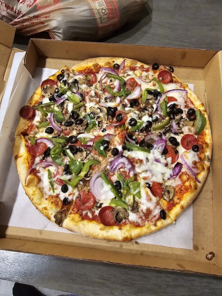 The Deluxe Pizza